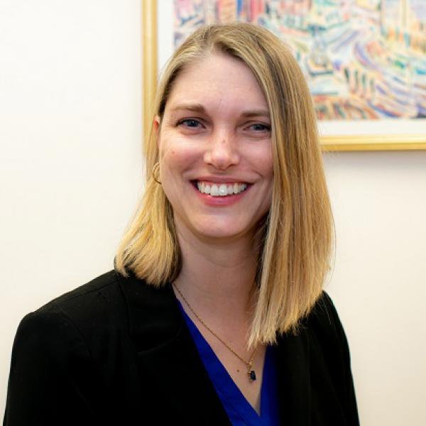 Smiling younger white woman with shoulder length straight blonde hair